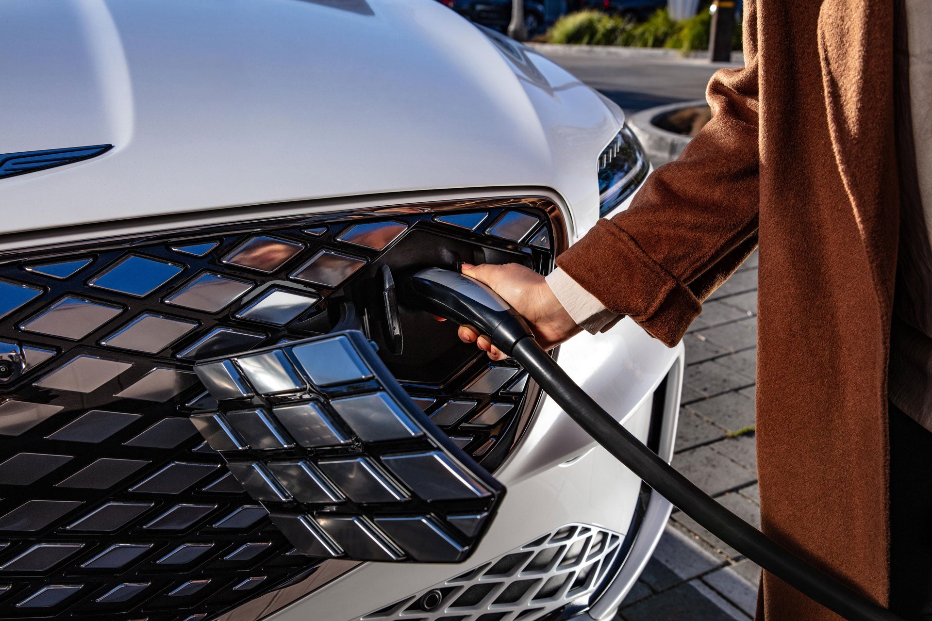 A Genesis GV70 SUV charging
